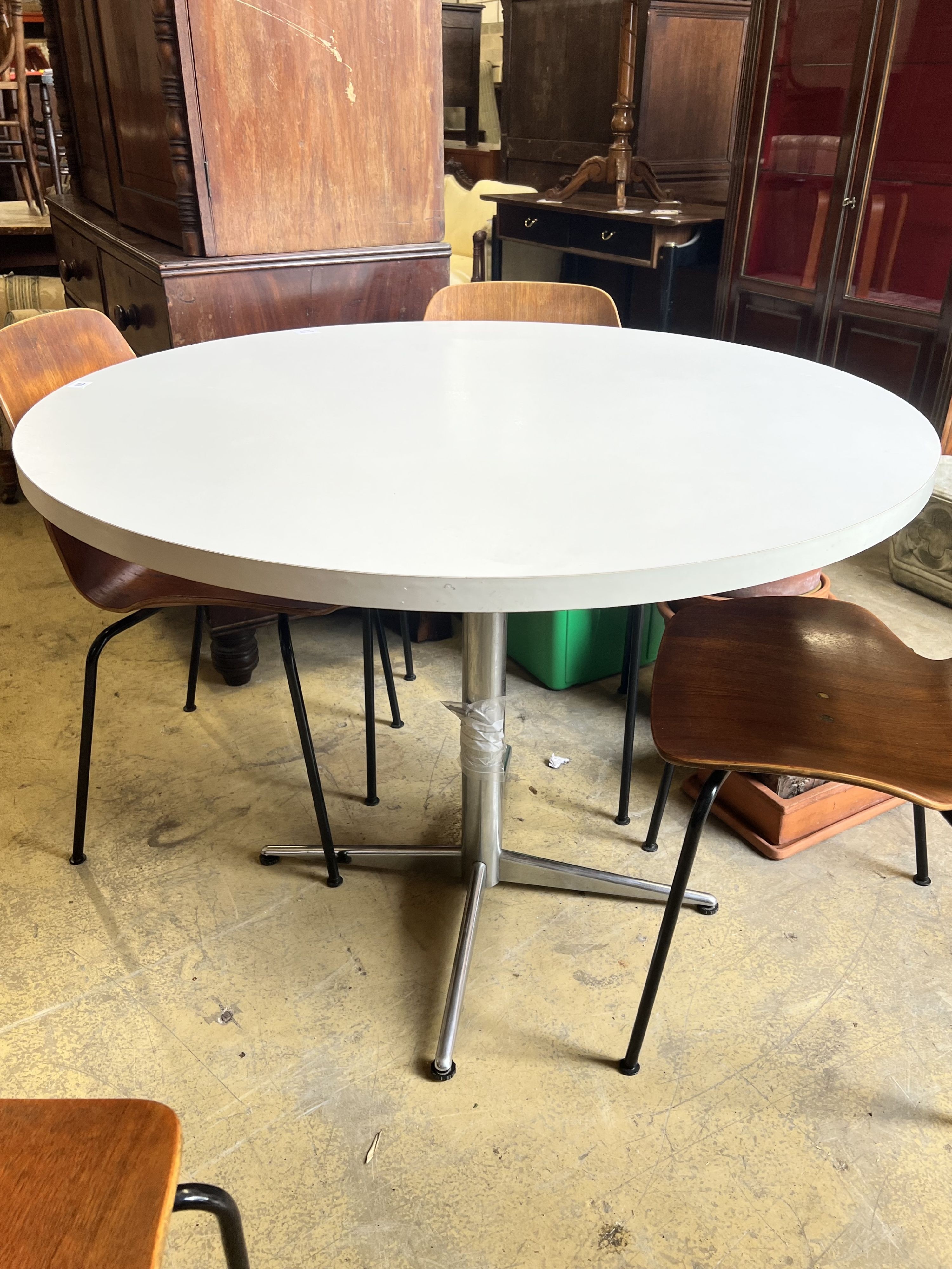 A set of four Westnofa chairs and a circular table, diameter 110cm height 77cm